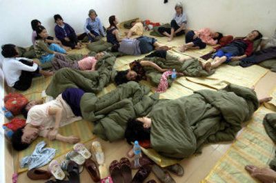 
Villagers whose houses were submerged by floodwaters rest in a temporary settlement in Huizhou, in east China's Guangdong province, on Saturday. The death toll in two weeks of flooding in areas throughout China has risen by 31 to at least 567. 
 (Associated Press / The Spokesman-Review)