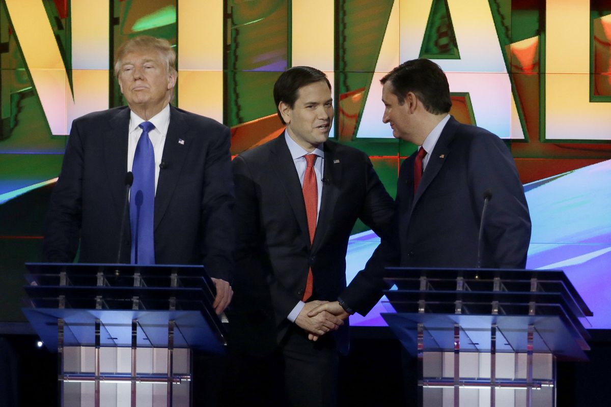 Republican presidential candidate businessman Donald Trump, pauses as Republican presidential candidate Sen. Marco Rubio, R-Fla., center and Republican presidential candidate Sen. Ted Cruz, R-Texas, greet at a break during a Republican presidential primary debate at the University of Houston, Thursday, Feb. 25, 2016, in Houston. (David J. Phillip / Associated Press)