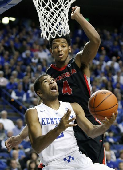 Kentucky's Aaron Harrison, bottom, scored 23 points. (Associated Press)