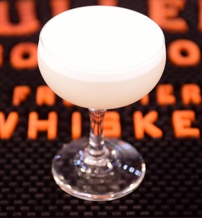The White Lady is a frothy gin classic cocktail. This one is prepared by Simon Moorby of Hogwash Whiskey Den. (Jesse Tinsley / The Spokesman-Review)