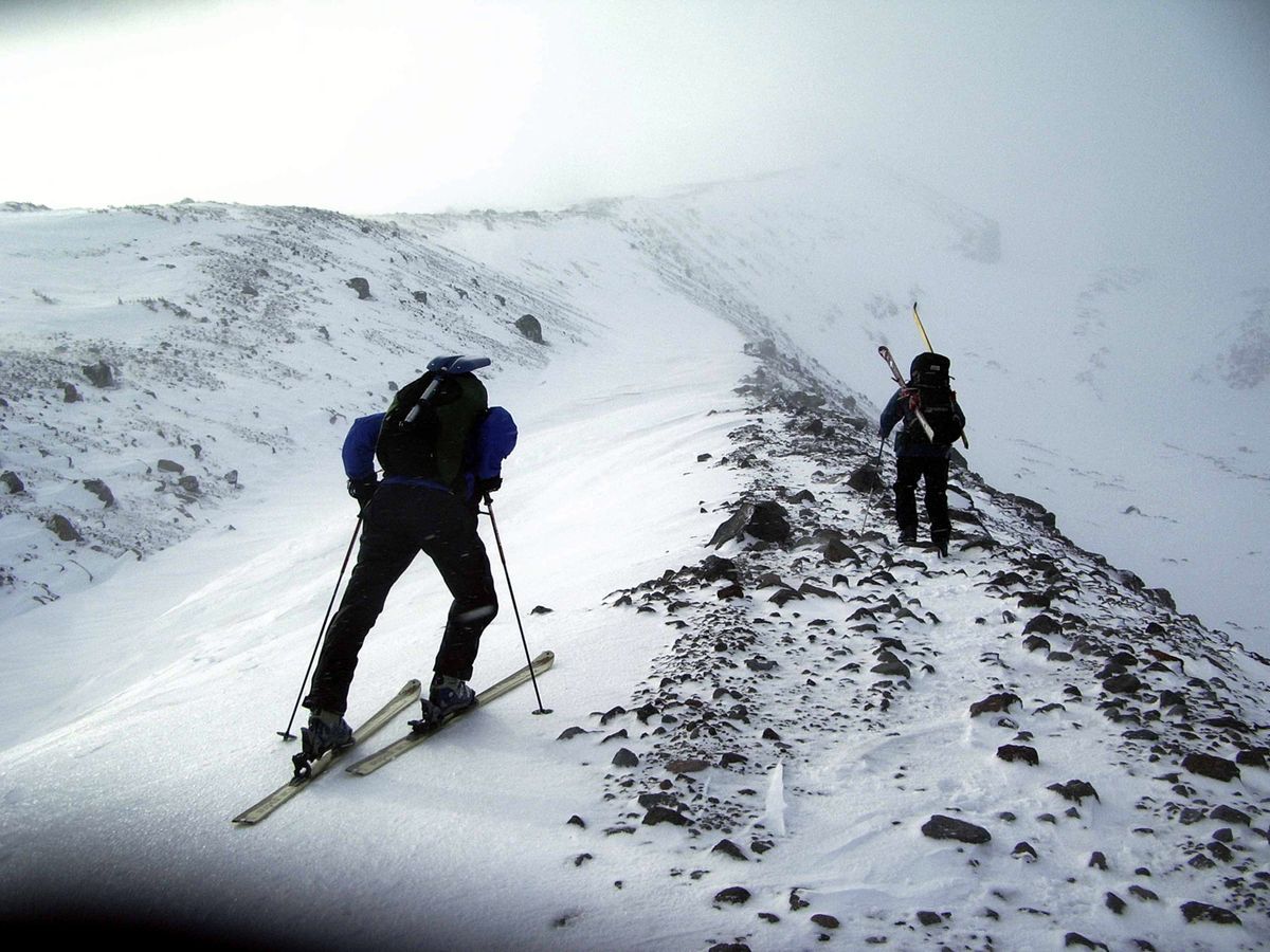 Corvallis Mountain Rescue Unit volunteers try to search the north side of Mount Hood in Oregon on Dec. 12, 2006, as the mountain continues to be engulfed in a storm. Rescue teams tried to head up flanks of the treacherous mountain daily to search for three climbers reported missing in heavy snow. No real break in the weather came until Dec. 16. Searchers found the snow cave with Kelly James’ body on Dec. 17. The search for his companions was called off four days later. Associated Press file photos (Associated Press file photos / The Spokesman-Review)