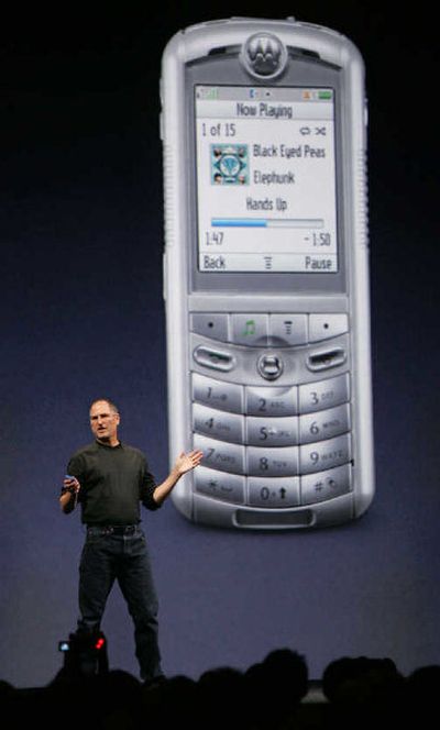 Apple Computers Inc. CEO Steve Jobs introduces the first mobile phone with iTunes on Wednesday.
 (Associated Press / The Spokesman-Review)