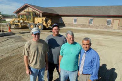 
The local building committee, made up of, from left, Josh Davis, Steve Cole, Mike Isley and Gabe Adabashi, helped oversee the construction of the new Kingdom Hall of the Jehovah's Witnesses in Rathdrum. The building was one of three built simultaneously in Coeur d'Alene, Rathdrum and Sandpoint in about 10 days by hundreds of volunteers. Not pictured is building committee member  Steve Soper. 
 (JESSE TINSLEY photos / The Spokesman-Review)