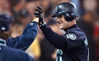 
Seattle's Edgar Martinez smiles following his 299th career home run.M's starting pitcher Ryan Franklin allowed just two runs.
 (Associated PressAssociated Press / The Spokesman-Review)