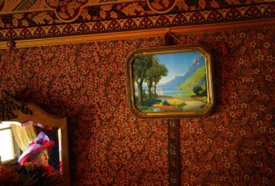 
A member of the Libby Red Hat Rebels, is reflected in a period mirror at Foxwood House during a tea party. The Newport home was constructed and decorated with Victorian-era furnishings and architecture. 
 (Photos by Brian Plonka/The spokesman-review / The Spokesman-Review)