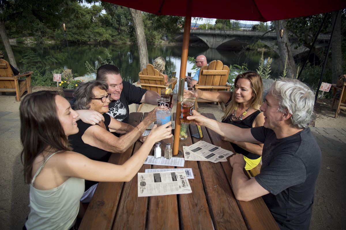 No-Li Brewhouse features outdoor seating along the Spokane River. (Colin Mulvany / The Spokesman-Review)