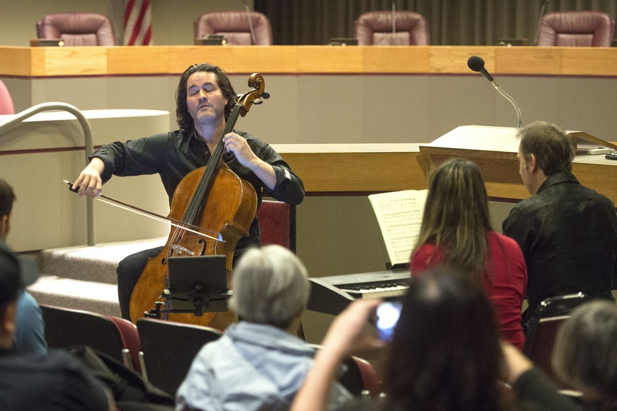 Zuill Bailey, left, performs Vivaldi Concerto for Cello, during a Flash-Bach earlier this year in the Spokane City Council Chambers in downtown Spokane. Bailey received a Grammy nomination Tuesday for best classical instrumental solo for his work on “Daugherty: Tales of Hemingway.” (Dan Pelle / The Spokesman-Review)