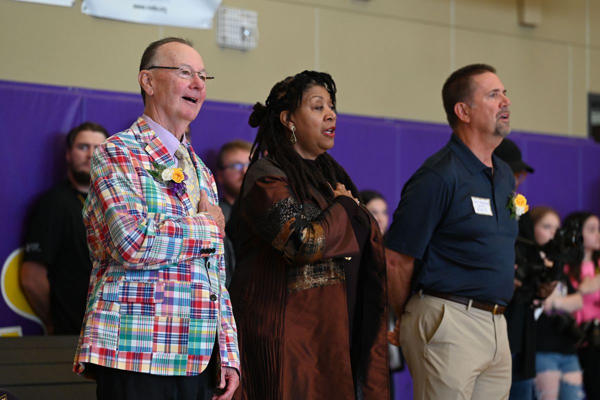 Rogers High School alumni Gary Libey, Patty Holley and Earl Howerton sing the national anthem at the annual Walk of Fame induction at Rogers Friday, Oct. 6, 2023. Libey, a longtime attorney, is now a Superior Court Judge and is hearing the WSU lawsuit agains the PAC12 over the breakup of the conference. Holley was a dancer and actress, appearing in many shows and videos over her career. Howerton was a Spokane Sheriff