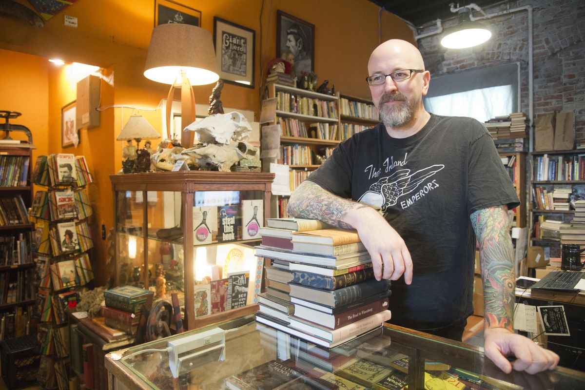 Owner Nathan Huston stands March 17 in his eclectic bookstore, Giant Nerd Books, at 709 N. Monroe St. in Spokane. (Jesse Tinsley / The Spokesman-Review)