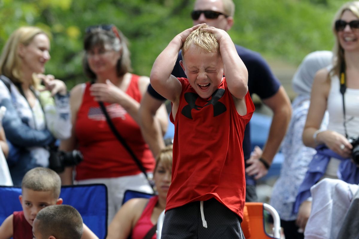 Caden Culver, 6, of Sammamish, Wash., reacts as he watches his teammates during Hoopfest in Spokane on Saturday, June 30, 2012. (Kathy Plonka)
