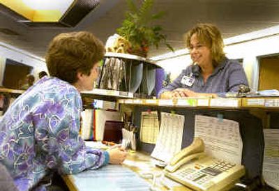 Medical social worker Jessica Blankenship, who helps uninsured patients find resources to help pay for medical care, stops to chat with nurse Sue Johnson at Kootenai Medical Center.
(Jesse Tinsley / The Spokesman-Review)