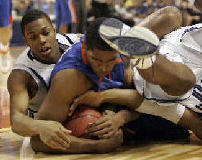 
Villanova's Kyle Lowry, left, and Florida's Al Horford fight for the ball while Villanova's Will Sheridan kicks in. 
 (Associated Press / The Spokesman-Review)