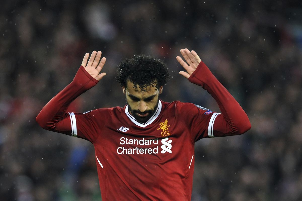 Liverpool’s Mohamed Salah celebrates after scoring his side’s second goal during the Champions League semifinal, first leg, soccer match between Liverpool and Roma at Anfield Stadium, Liverpool, England, Tuesday, April 24, 2018. (Rui Vieira / Associated Press)