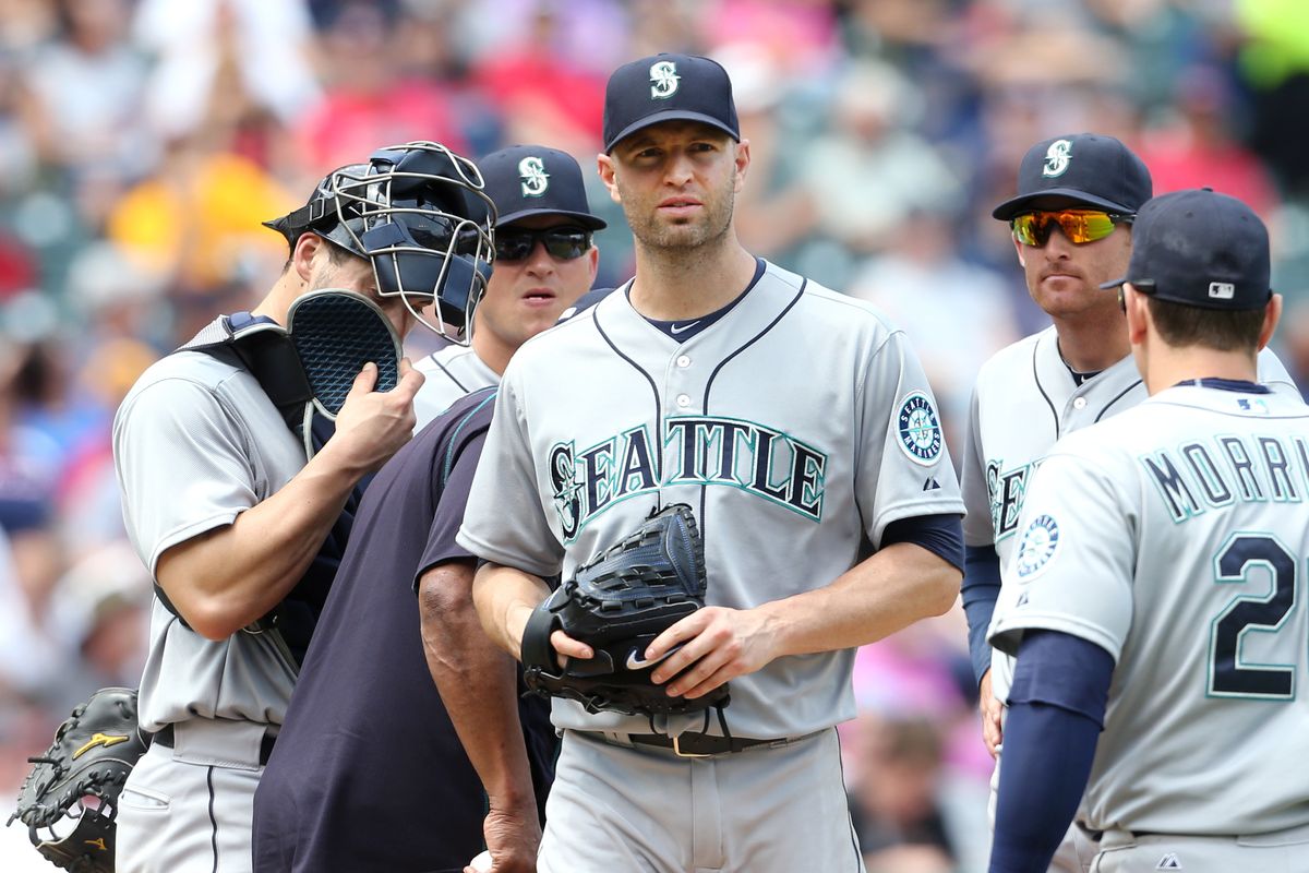 Mariners’ lefty J.A. Happ, center, lasted just 2 1/3 innings, allowing four earned runs on Thursday in Cleveland. (Associated Press)