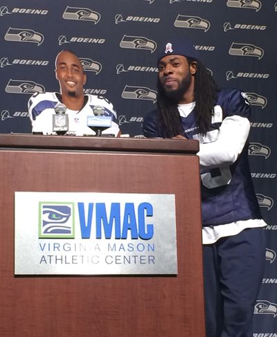 Seattle’s Richard Sherman, right, solicits laughs with Doug Baldwin cardboard cutout on Tuesday. (Associated Press)