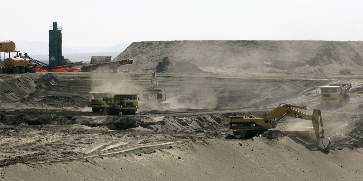 This April 3, 2008, photo shows workers using heavy equipment to bury contaminated debris in a landfill on the Hanford Nuclear Reservation near Richland. The federal government spends about $2 billion a year on cleanup at the Hanford site. Associated Press photos (File Associated Press photos / The Spokesman-Review)