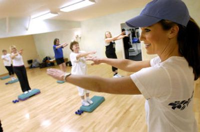
Fitness trainer Natalie Litzell, right, leads her class at Natural Fitness in Sandpoint. Many of them took part in a contest Litzell called 