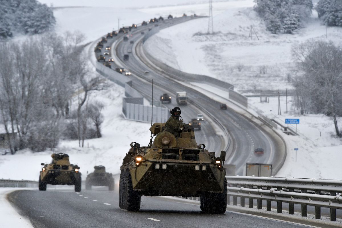 A convoy of Russian armored vehicles moves along a highway in Crimea on Tuesday. (STR)