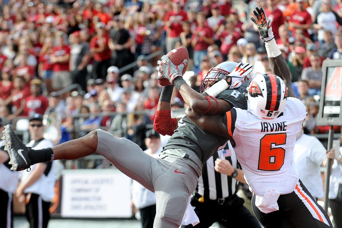 Washington State Cougars wide receiver Tavares Martin Jr. (8) hauls in a touchdown pass over Oregon State Beavers cornerback Jay Irvine (6) runs the ball during the first half of a PAC-12 football game on Saturday, September 19, 2017, at Martin Stadium in Pullman, Wash. (Tyler Tjomsland / The Spokesman-Review)