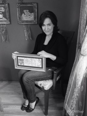 Susanna Baylon holds the framed invitation that brought marriage and a family. (Cheryl-Anne Millsap / Photo by Cheryl-Anne Millsap)