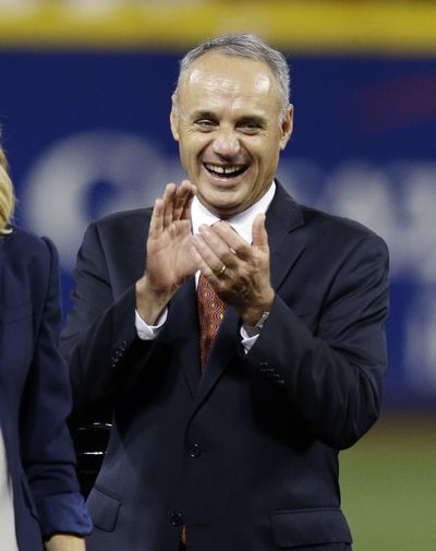 Rob Manfred says with more playoff teams, trade deadline may need to be pushed back. (Associated Press)