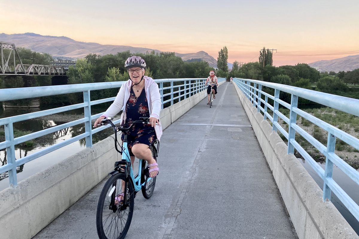 Leslie and her sister Laurel ride the Apple Capital Recreation Loop Trail in Wenatchee. (John Nelson)