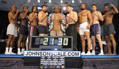
Don King, center, poses Thursday with the eight heavyweights that will fight. King, promoting a card weighing over a ton, turned out to be the heaviest on display. 
 (Associated Press / The Spokesman-Review)