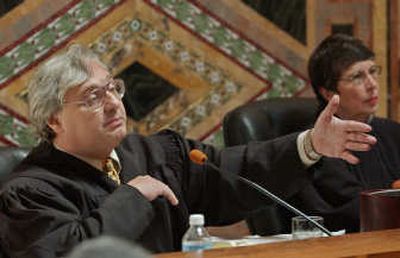 
Judge Alex Kozinski, of the 9th U.S. Circuit Court of Appeals, gestures as Chief Judge Mary Schroeder looks on in this September  2003 file photo. Associated Press
 (File Associated Press / The Spokesman-Review)