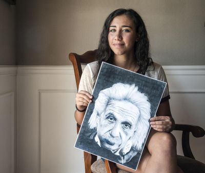 Sophia DeFelice has won the Congressional Art Competition 2016 for her pencil drawing of Albert Einstein. DeFelice, 16, will be a junior at Gonzaga Prep in the fall. Here, she holds a copy of her art. The original is in Washington, D.C. (Dan Pelle / The Spokesman-Review)