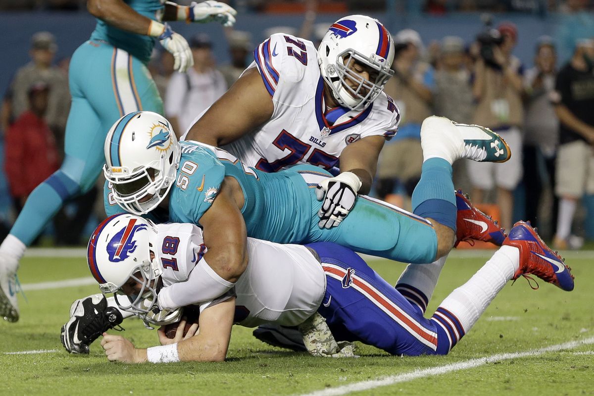 Bills quarterback Kyle Orton is sacked by Dolphins defensive end Olivier Vernon. (Associated Press)