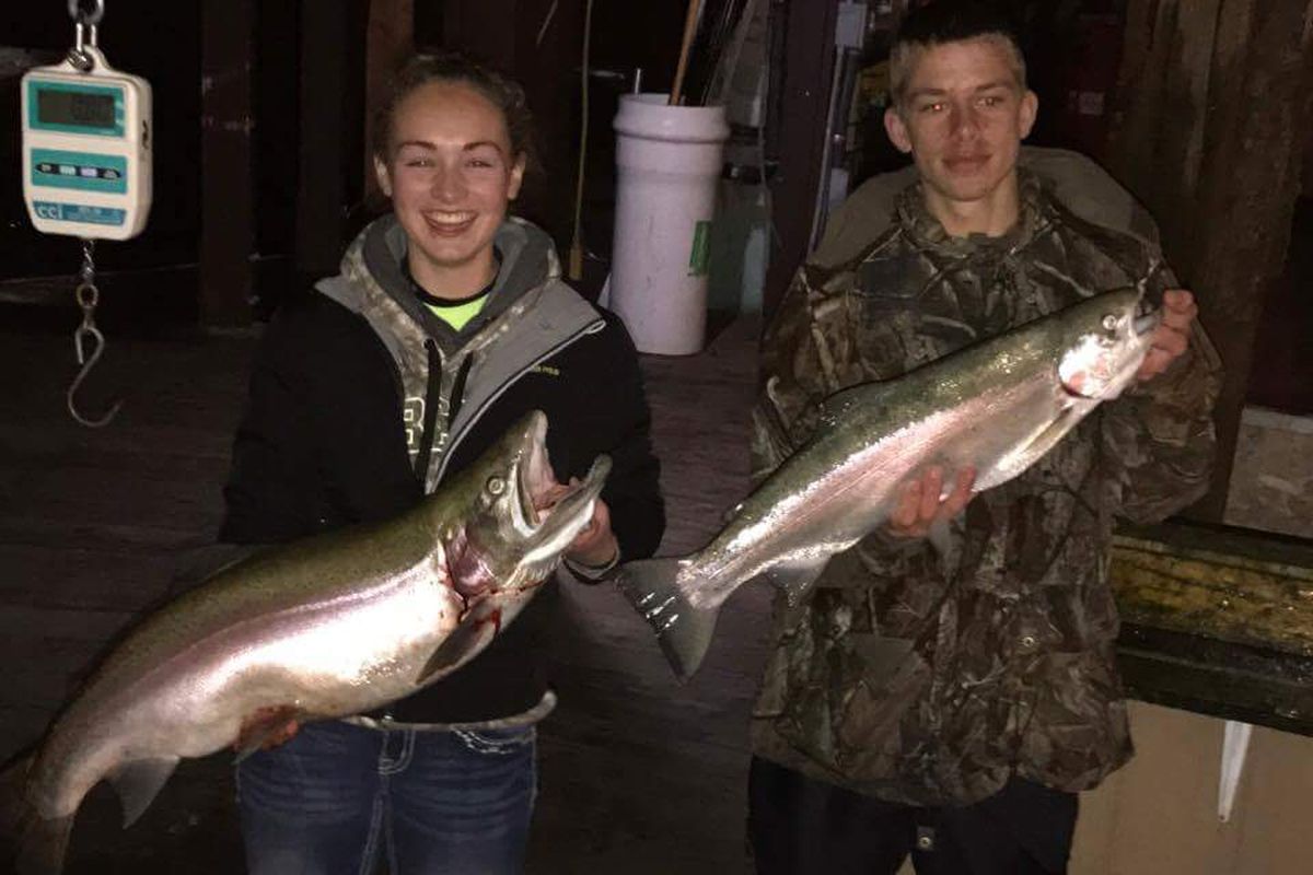 Alexis Berube holds a  19-pound, 35 inch long rainbow -- the largest fish recorded in the first three days of the Lake Pend Oreille Fall Fishing Derby. Cameron Roslak turned in a rainbow weighing  8.44 pounds. (Courtesy)