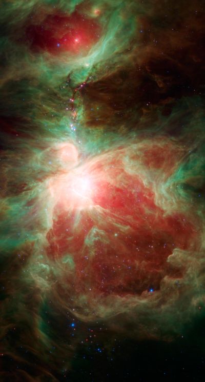 This image from NASA’s Spitzer Space Telescope shows what lies near the sword of the constellation Orion – an active stellar nursery containing thousands of young stars and developing protostars. Many will turn out like our sun.  (NASA)