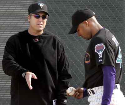 Bryan Price, left, didn’t like Arizona’s direction.  (Associated Press / The Spokesman-Review)