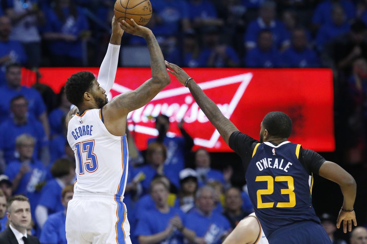 Oklahoma City Thunder forward Paul George (13) shoots in front of Utah Jazz forward Royce O’Neale (23) in the second half of Game 1 of an NBA basketball first-round playoff series in Oklahoma City, Sunday, April 15, 2018. (Sue Ogrocki / Associated Press)