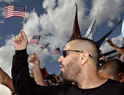 
Sebastien Perron of Cocoa Beach, Fla., sporting his red, white and blue mohawk shaped as a 