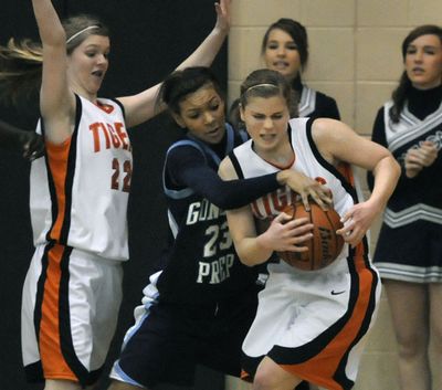 Gonzaga Prep’s Tia Presley battles Lewis and Clark’s Julia Moravec, left, and Megan Bech for a rebound. (Dan Pelle)