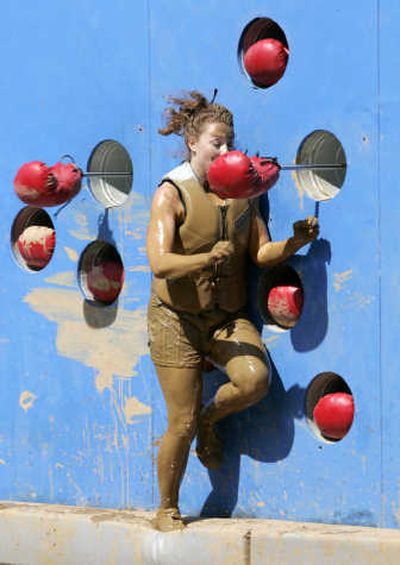
Contestant Cobi Brandel makes her way through the world's largest obstacle course as she competes in the ABC series 