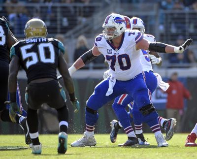 In this Sunday, Jan. 7, 2018, file photo, Buffalo Bills center Eric Wood (70) looks to block Jacksonville Jaguars outside linebacker Telvin Smith (50) during the first half of an NFL wild-card playoff football game in Jacksonville, Fla. Wood is retiring after nine seasons as a result of a debilitating neck injury. He revealed his decision in a statement the Bills posted on their Twitter account on Friday, Jan. 26, 2018. (Phelan M. Ebenhack / Associated Press)