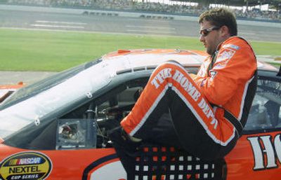 
Tony Stewart climbs out of his car following his qualifying run for Sunday's UAW-Ford 500 race.
 (Associated Press / The Spokesman-Review)