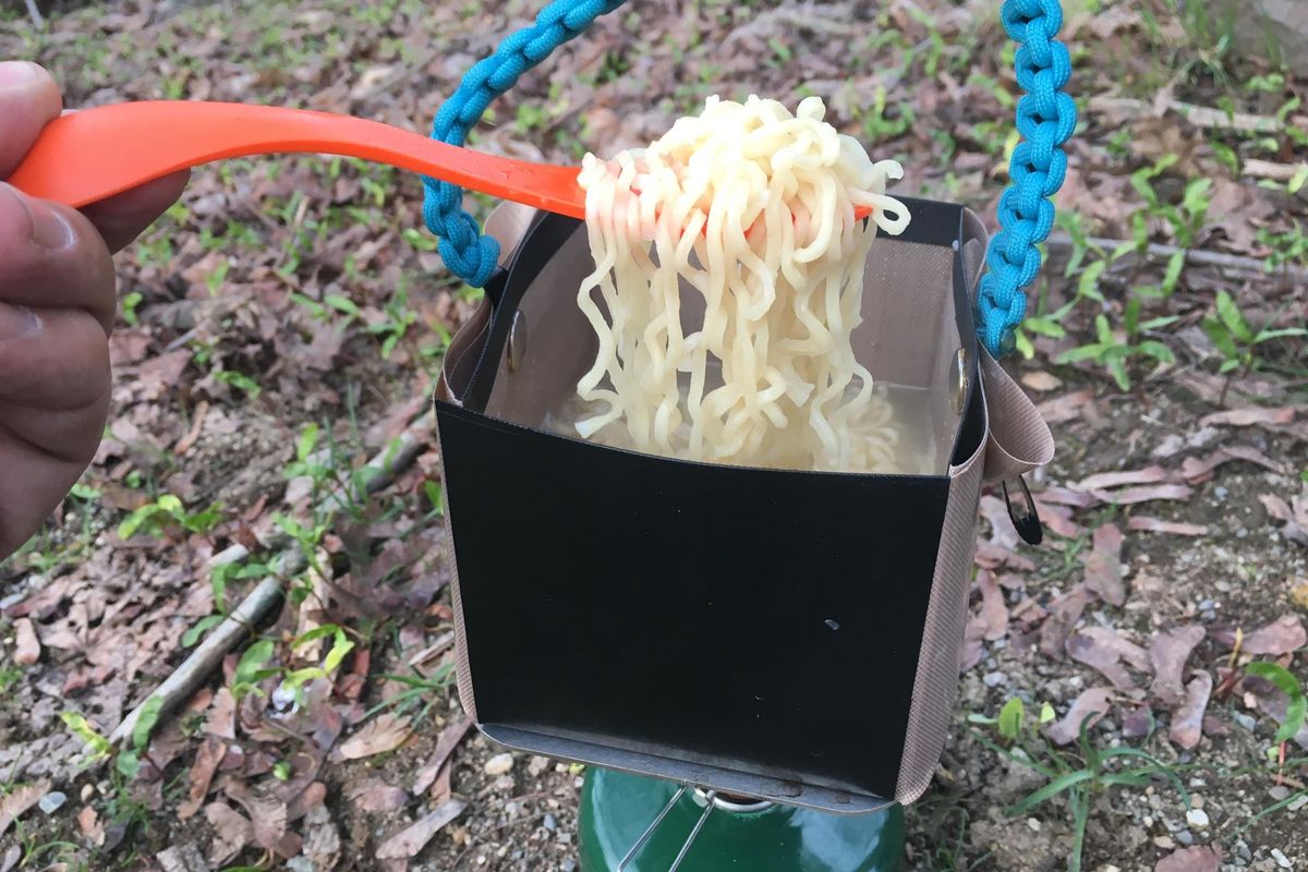 Cory Santiago demonstrates how to cook noodles using one of his Bear Bowls. (Courtesy of Bear Minimum)