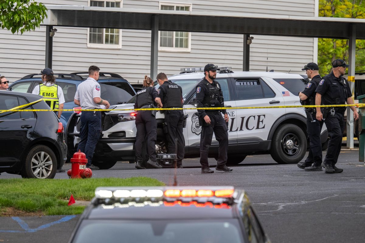 Spokane police investigate a two-person homicide at an apartment complex at 3308 E. 11th Ave. in May 2025.  (COLIN MULVANY)