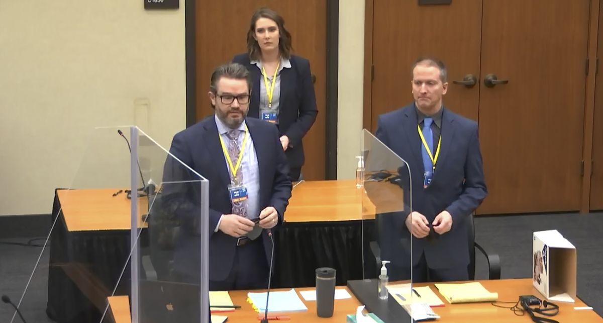 In this image taken from video, defense attorney Eric Nelson, left, defendant former Minneapolis police officer Derek Chauvin, right, and Nelson