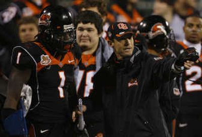 
OSU coach Mike Riley talks with linebacker Dennis Christopher. Associated Press
 (Associated Press / The Spokesman-Review)