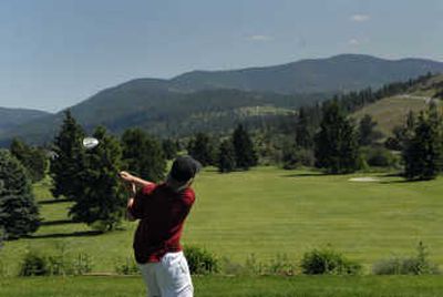 
A golfer tees off the No. 1  hole at Trailhead Golf Course in Liberty Lake. 
 (Brian Plonka / The Spokesman-Review)