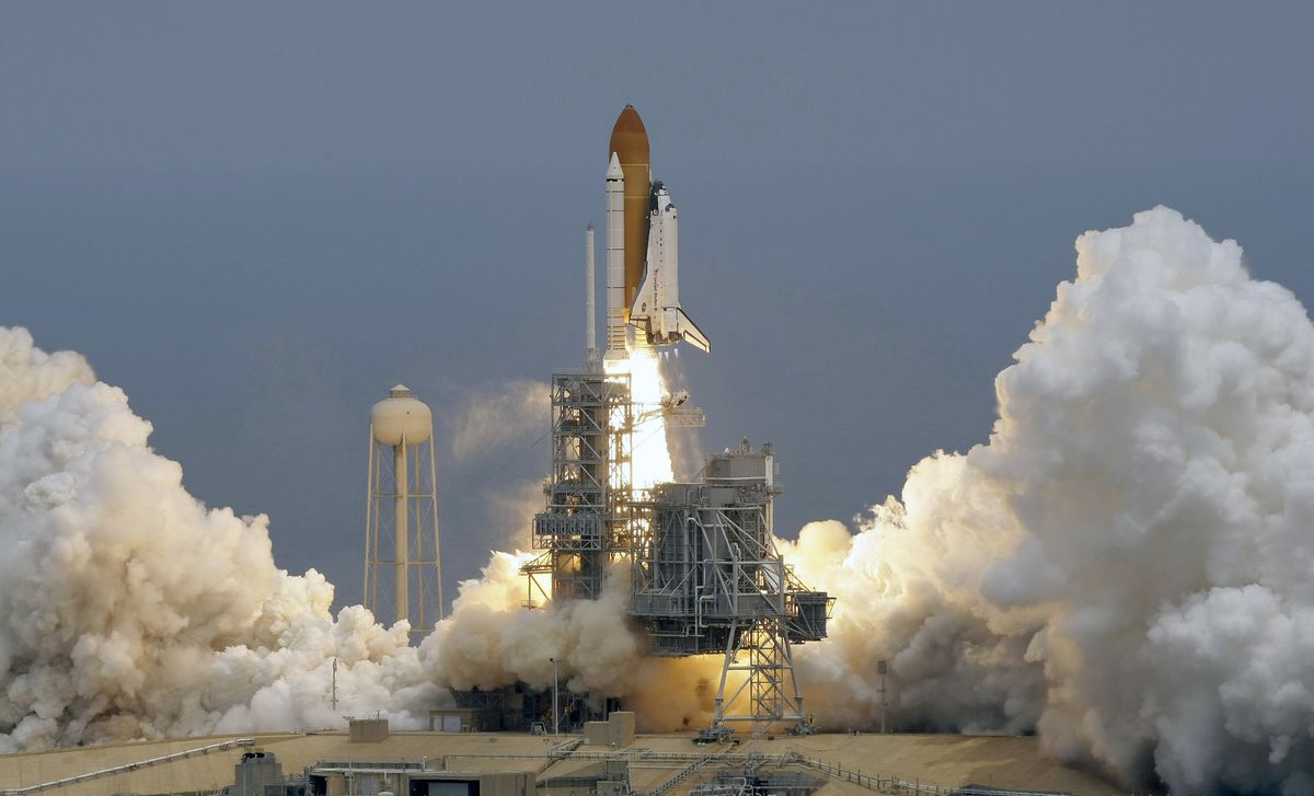 The space shuttle Atlantis lifts off Monday  at the Kennedy Space Center in Cape Canaveral, Fla. Associated Press photos (Associated Press photos / The Spokesman-Review)