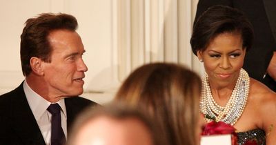 California Gov. Arnold Schwarzenegger and First lady Michelle Obama talk with their table guests during a dinner for  governors hosted by President Barack Obama at the White House on Sunday.  (Associated Press / The Spokesman-Review)