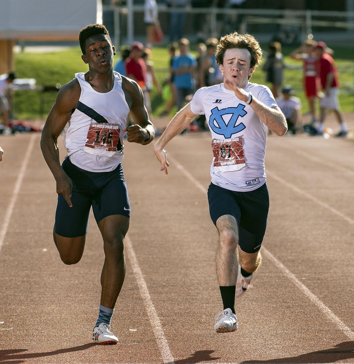 Central Valley’s Austin Porter, on right, edges out Gonzaga Prep’s Xzandre Jean-Francois to win the Boys 4A 100 Meter Dash, Friday, May 9, 2019, during the 2019 GSL League Championship track meet held at Central Valley High School. (Colin Mulvany / The Spokesman-Review)
