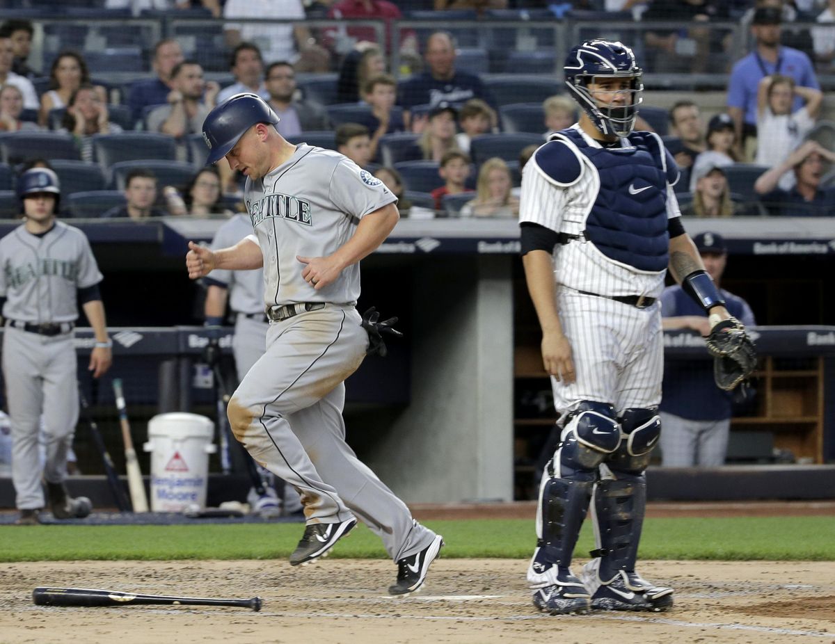 Seattle Mariners’ Kyle Seager, left, scores past New York Yankees catcher Gary Sanchez on a single hit by Denard Span during the fourth inning of a baseball game at Yankee Stadium Wednesday, June 20, 2018, in New York. (Seth Wenig / Associated Press)