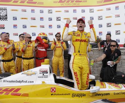 IndyCar driver Ryan Hunter-Reay celebrates in victory circle after winning a second consecutive race at the Milwaukee Mile. (Associated Press)