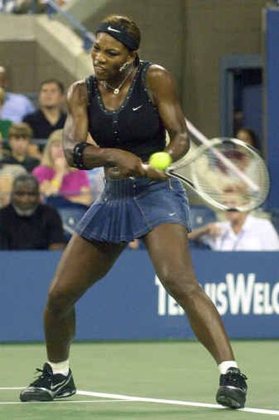 
Serena Williams  hits a return to Sandra Kleinova in first-round action Monday. 
 (Associated Press / The Spokesman-Review)